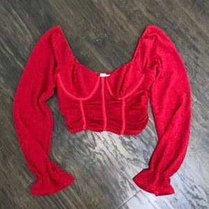 Red crop top in size S.